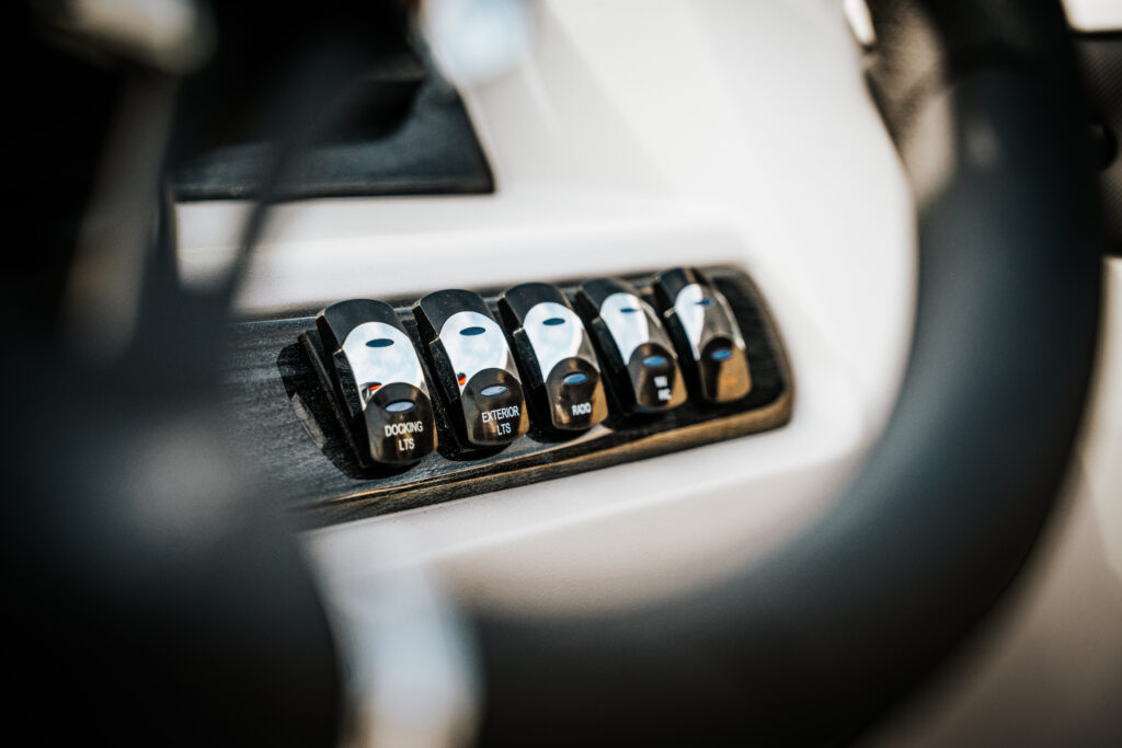 Control panel with switches labeled "Docking LTS," "Exterior LTS," and "Rood," featuring a sleek design relevant to the 2026 Avalon LSZ boat's interior.