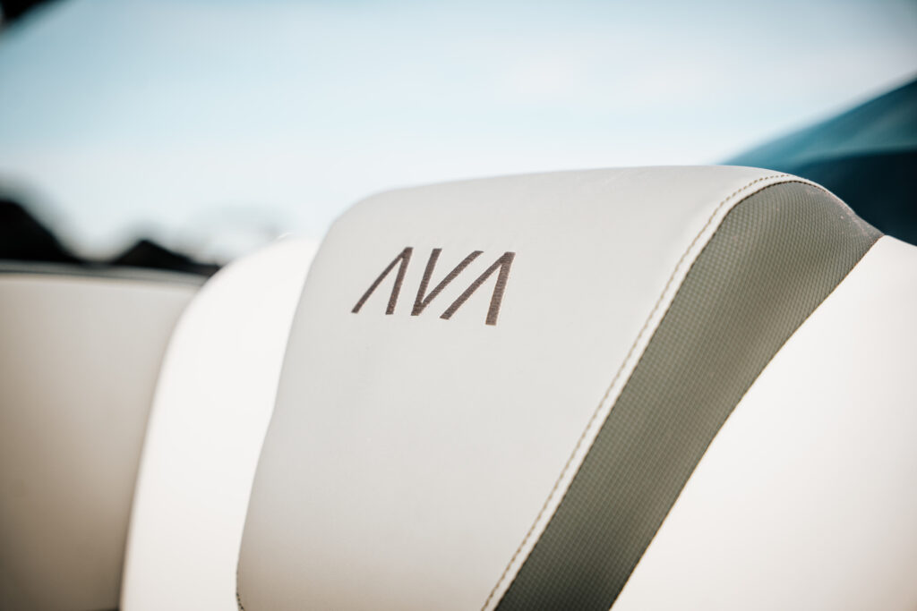 Avalon logo on plush seating in the 2026 Avalon LSZ boat, showcasing luxury design and comfort features.