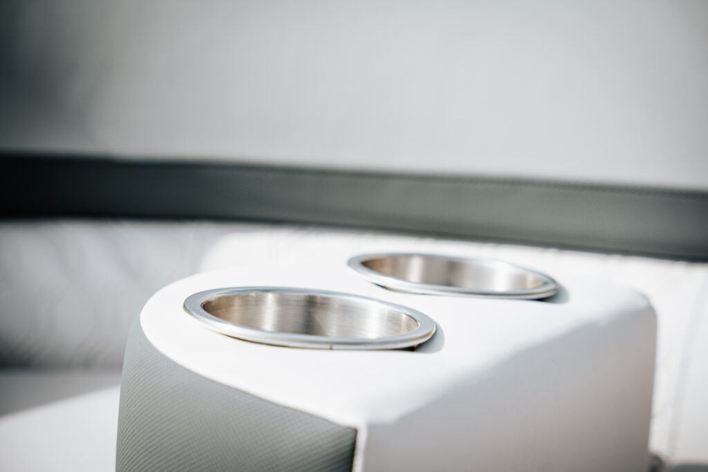 Cup holders on the rear bench of the 2026 Avalon LSZ boat, showcasing sleek design and premium materials.