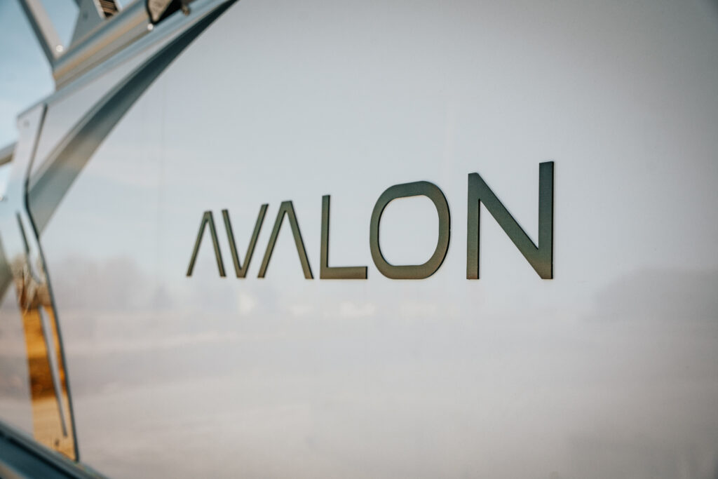 Avalon logo on the side of the 2026 Avalon LSZ boat, showcasing brand identity and sleek design.