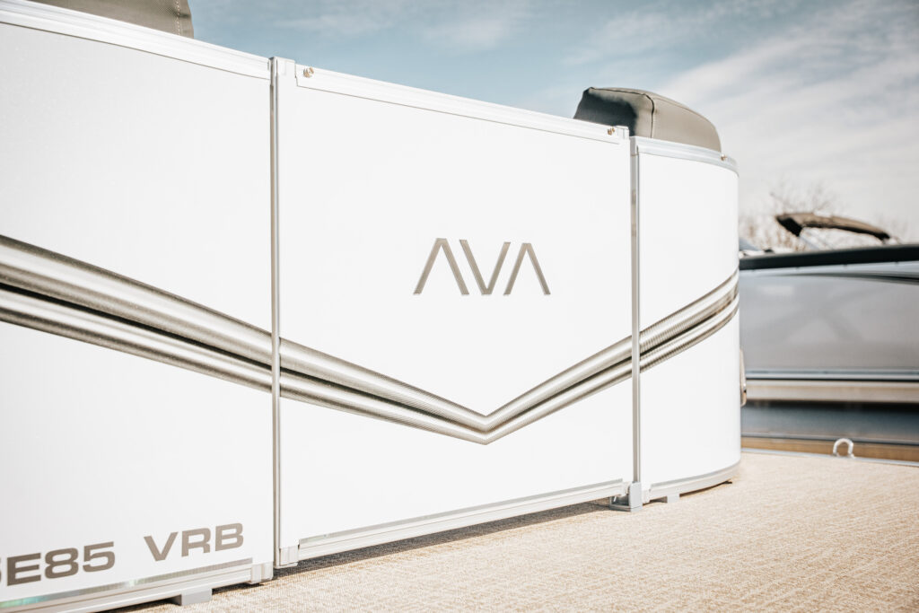 Avalon LSZ boat side view showcasing sleek white exterior, logo, and design details, emphasizing premium features and craftsmanship.