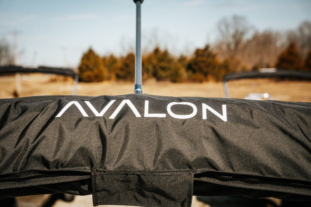 Avalon logo on black boat cover, showcasing the premium design associated with the 2026 Avalon Catalina Quad Lounger.