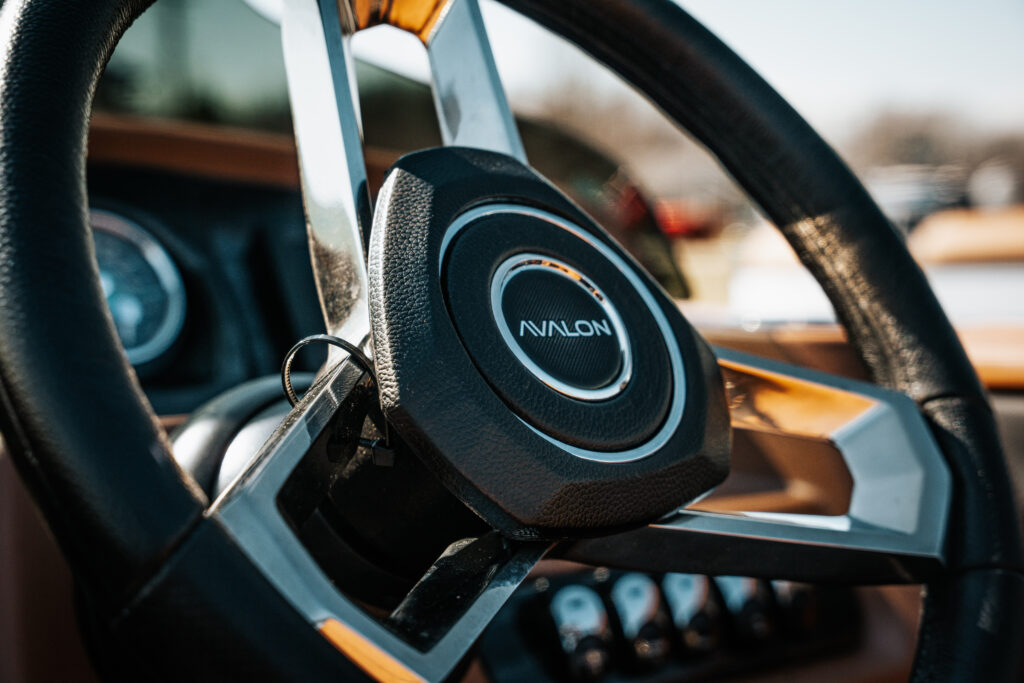 Avalon steering wheel with logo, showcasing luxury boat interior design elements, in context of 2026 Avalon LSZ specifications and features.
