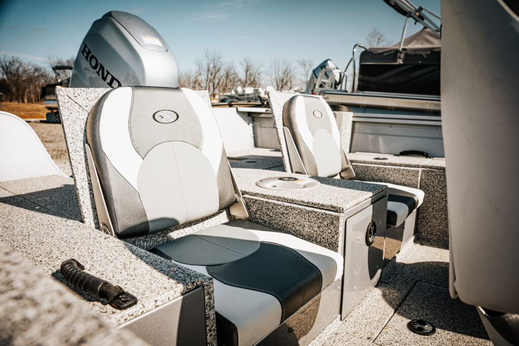Comfortable upgraded fishing seats in the 2024 Polar Kraft Frontier 165 SC boat, featuring a Honda motor and stylish design elements.