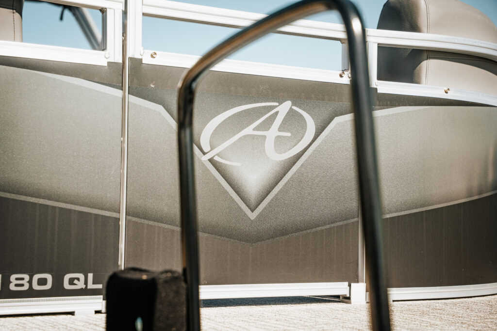 Avalon logo on the side of the 2024 Venture Quad Lounger boat, showcasing sleek design and premium materials.